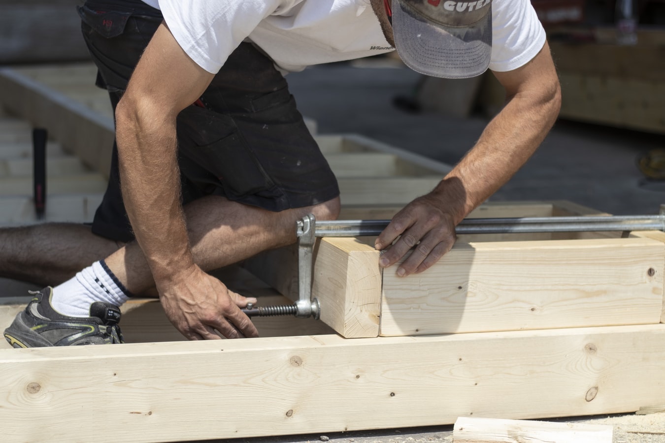 man building wooden base